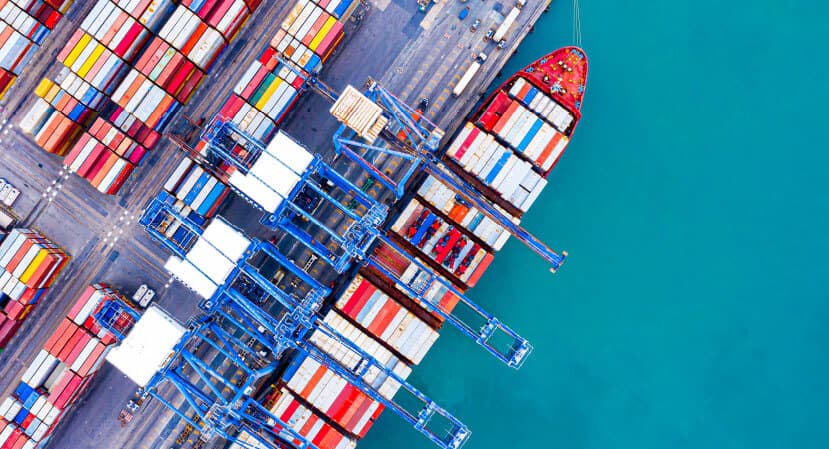 Aerial view of a container ship berthed at a port terminal